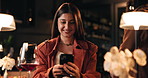 Wine, phone and smile with woman in restaurant for online dating, communication and reading. Relationship app, drinking and partner search with person and mobile for connection, contact and alcohol