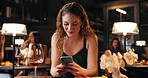 Happy, wine and woman with phone in restaurant for social media, online dating and website. Typing, diner and person with alcohol drink on smartphone for internet, text message and communication