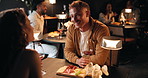 Conversation, date and romance with couple in restaurant at night for bonding or celebration. Fine dining, love and smile with people at table together for anniversary, cuisine or relationship chat