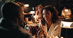 Date, holding hands and talking with couple in restaurant at night for bonding or celebration. Fine dining, love and romance with people at table together for anniversary, cuisine or marriage