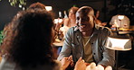 Date night, holding hands and romance with couple in restaurant for bonding or celebration. Fine dining, love and smile with people at table together for anniversary, conversation or cuisine