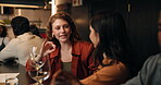 Friends, drinking or women with talking at wine bar for social gathering, alcohol tasting or bonding. Happy, people and relax with drinks at restaurant for weekend break, hangout and conversation