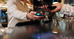 Hands, people and machine with phone payment, transaction and fintech at bar. Bartender, person and electronic pos for alcohol checkout, purchase drinks and contactless for customer experience at pub