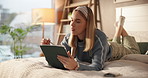 Woman, thinking and tablet on bed for creativity, drawing hobby and connectivity in home. Graphic design, student and relax in bedroom with tech, online inspiration and stylus for digital creation