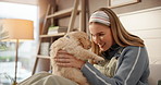 Relax, woman and playing with puppy in home for connection, bonding together and pet adoption. Love, dog mom and stroke furry best friend in apartment for affection, security and domestic companion