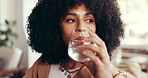 Pill, water and woman on sofa in home with medicine, vitamins or supplements for health. Tablets, relax and female person with prescription medication and hydration for wellness in living room.