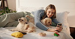 Puppies, happy and dog mom with selfie on bed in home bedroom for fun, development or bonding. Pets, adoption and house with golden retriever animals and person for love, care and social media