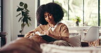 Creative, woman and writing in living room, home and journalist with notes for story, plan and busy. Remote work, reporter and person with notebook for project, inspiration and planner in house