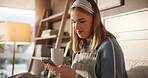 Happy, woman and message on smartphone, home and texting on social media with coffee, relax and app. Browsing, web and person with mobile for communication, caffeine and smile for chat with tech
