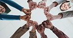 Fist bump, below and hands of business people in office for teamwork, collaboration and support. Community, startup company and workers in circle for solidarity, cooperation and partnership synergy