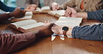 Bible study, group and friends holding hands in prayer for spiritual guidance, religion or belief. Christian community, faith and circle of people in home with worship, support or praise God together