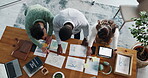 Documents, discussion and team with above of business people for meeting, invoice sheet and research. Profit report, partnership and writing with employees in office for paperwork and growth