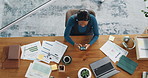 Above, phone and business woman typing email, text message and notification for financial chart. Mobile, top view and African worker in office for report analysis, networking and investment metrics