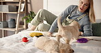 Dog mom, puppies and care or playing in home bedroom for bonding, love and affection on bed. Woman, dogs or golden retriever pets together for development, adoption and stroke to relax in house