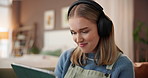 Headphones, tablet and woman on sofa in home with networking, relax and listening to music. Happy, digital technology and female person with audio tech for streaming playlist on app in living room.
