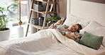 Calm, pet and woman with phone in bedroom, texting or chilling with puppy in home, online and relax. Browsing, person and resting with dog on bed, peace and bonding with canine in house or mobile app