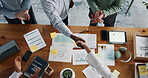 Handshake, success and documents with business people in office for teamwork, winner and goals. Partnership, collaboration and above with employees shaking hands in agency for support and applause
