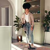Home, cleaning and black woman with vacuum for dust, hygiene and floor ...