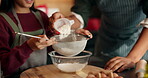 Dad, girl and hands with sifting for flour with cooking, teaching and ingredients for cookies in home. African people, father and daughter in kitchen, learning and sieve for baking with family