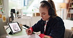 Graphic designer, headphones and woman on tablet in office for online illustration, web design and ui. Creative agency, worker and person with music on tech for digital drawing, website and project