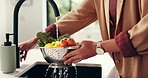 Washing, water and woman with vegetables in kitchen for nutrition, natural ingredients and wellness. Cooking, home and person by sink with fresh food for meal prep, hygiene and cleaning for lunch