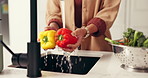 Washing, water and woman with vegetables in kitchen for nutrition, natural ingredients and wellness. Cooking, home and person by faucet with bell pepper for meal prep, hygiene and cleaning for lunch