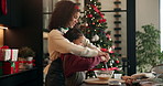 Christmas, baking and mom with child in kitchen with bowl for cookies, dessert and cake recipe. Family, home and mother with girl with ingredients for teaching, baker skills and holiday tradition