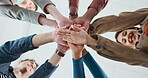 Low angle, hand pile and business people in office for teamwork, collaboration and support. Community, startup company and workers in circle for solidarity, cooperation and partnership synergy