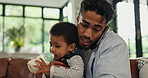 Phone call, bottle and father with baby in home for feeding, bonding or multitasking in living room. Single parent, care and dad with child drinking milk for growth, development or nutrition in house
