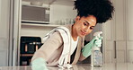 Home, woman and cleaning with chemical, gloves and spray for hygiene in kitchen, chores and cleaner. Wiping, counter and person with product for bacteria prevention, disinfection and liquid in house
