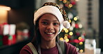 Face, child and smile for Christmas, home or santa hat for festive season, confident or celebration. Happy, girl and kid in house on holiday, excited and decorations on tree, event and December