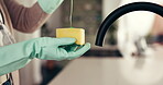 Hands, person and cleaning with sponge at house for washing dishes, daily chores and disinfection. Cleaner, glove and liquid for bacteria prevention, dirt removal and soap chemical of kitchen hygiene