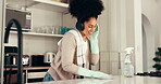 Cleaning, woman and listen to headphones, kitchen and chores with chemical in home and disinfection. Happy, person and glove for protection in house, music and streaming on app, hygiene or dancing