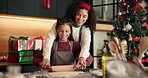 Baking, christmas and mom with child in kitchen for bonding, learning or preparing festive cookies. Rolling pin, xmas season and mother teaching kid with cooking for dessert, cake or biscuits in home