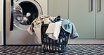 Laundry, washing machine and basket with clothes on floor for maintenance, housework or hygiene. Empty, apartment and container with textiles, fabric and material for housekeeping, cleaning or chores