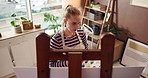 Canvas, easel and painting with woman in studio apartment for artistic or creative expression. Inspiration, learning and process with painter in home for art project, drawing activity or hobby