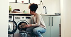Clothes, basket and cleaning with woman and washing machine for fabric, hygiene and linen. Laundry, housekeeping and cloth with person in washroom of home for cleaner, dryer and domestic chores