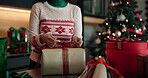 Ribbon, Christmas and gift with hands and wrapping paper for holiday season, celebration and bow. Present, festive tradition and package with person and box in home for decoration, parcel and event