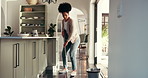 Dance, cleaning and black woman with broom in home for dust, hygiene and floor maintenance. Apartment, sanitation and happy person with music sweeping for housekeeping, housework and dirt prevention