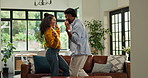 Happy, dancing and couple in home with music, fun or bonding together in living room with energy. Smile, love and man with woman for moving to playlist, album or radio for entertainment in apartment.