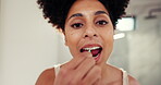 Floss pick, self care and face of woman in bathroom for morning, oral hygiene and routine. Cleaning teeth, wellness and fresh breath with person in home for smile, healthy gums and grooming with tool