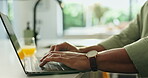 Freelancer, hands and typing on laptop in home for editing story draft, creative process or research. Writer, remote work or person with tech in kitchen for proofreading, writing article or blog post