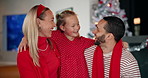 Christmas, hug and smile with family in living room of home together for celebration or tradition. Festive, love or security with dad, girl and mom embracing in apartment for December holidays