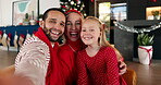 Christmas, face and selfie with family in living room of home together for celebration or tradition. Festive, hug or photograph with dad, girl and mom embracing in apartment for holiday memories