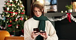 Credit card, christmas and woman in home with phone for online shopping with festive season deals. Debit, cellphone and female person with ecommerce store for xmas discount in living room at house.