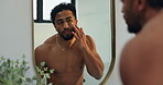 Mirror, skincare and man with face cream in home for moisturizer, skin glow and anti aging. Reflection, person and apply cosmetics product for self care, hyaluronic acid and getting ready in bathroom
