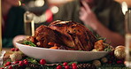 Roast chicken, family and christmas dinner in home for holiday celebration, food and eat together. Thanksgiving meal, festive event and decoration for hosting with vegetables, table setting or people