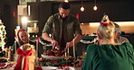 Cutting, chicken and family with feast, Christmas and meal for celebration on holiday, man and home. Happy, people and reunion for festive season in house, gourmet and gathering for dinner or bonding