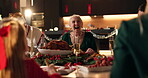 Family lunch, woman and laugh with eating on Christmas for celebration, funny joke or bonding. Home, social gathering or people with dinner party at night for holiday tradition, food feast or festive