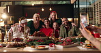 Hug, Christmas and big family with people for vacation, bonding and living room picture. December, holiday or festive season with grandparent, phone and dinner for social gathering and memory in home